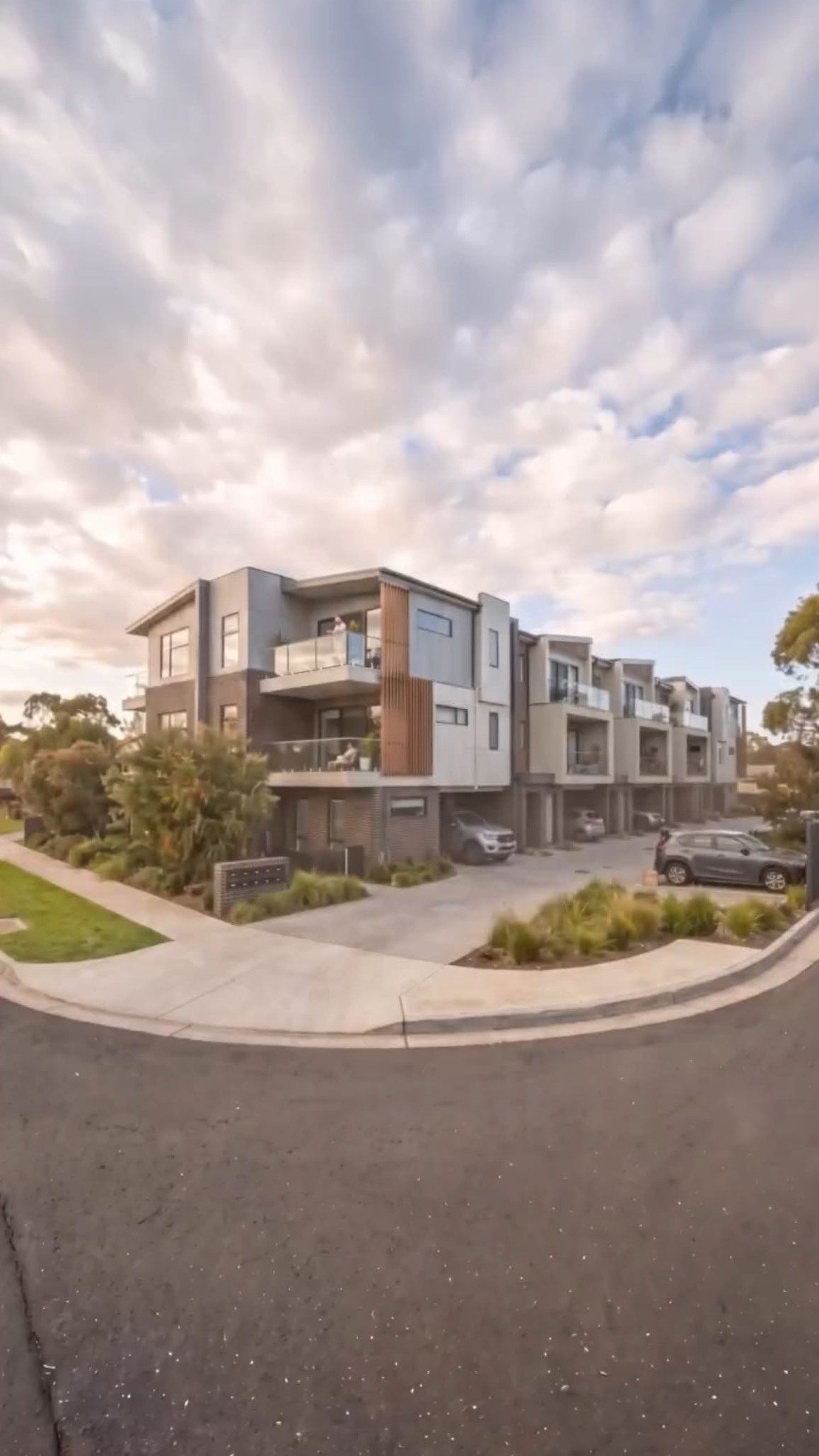 Charter Hall townhouse development under a dramatic sky